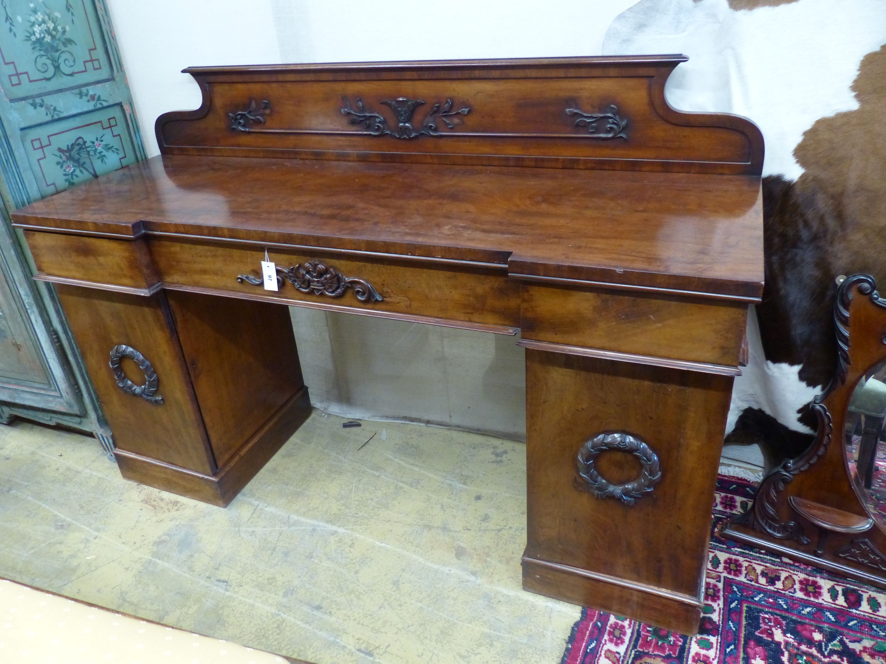 A Victorian mahogany break front pedestal sideboard, length 184cm, depth 56cm, height 125cm.